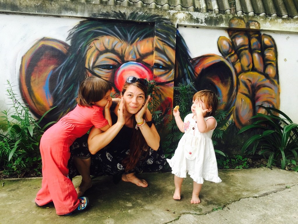 Family sharing a playful moment during a Thailand adventure